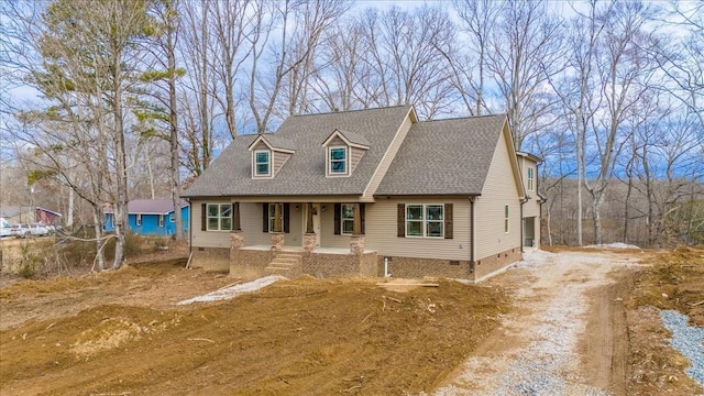 cape cod home featuring crawl space, driveway, a shingled roof, and a porch