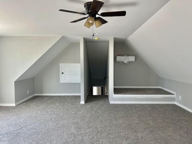 bonus room with lofted ceiling, carpet, baseboards, and ceiling fan