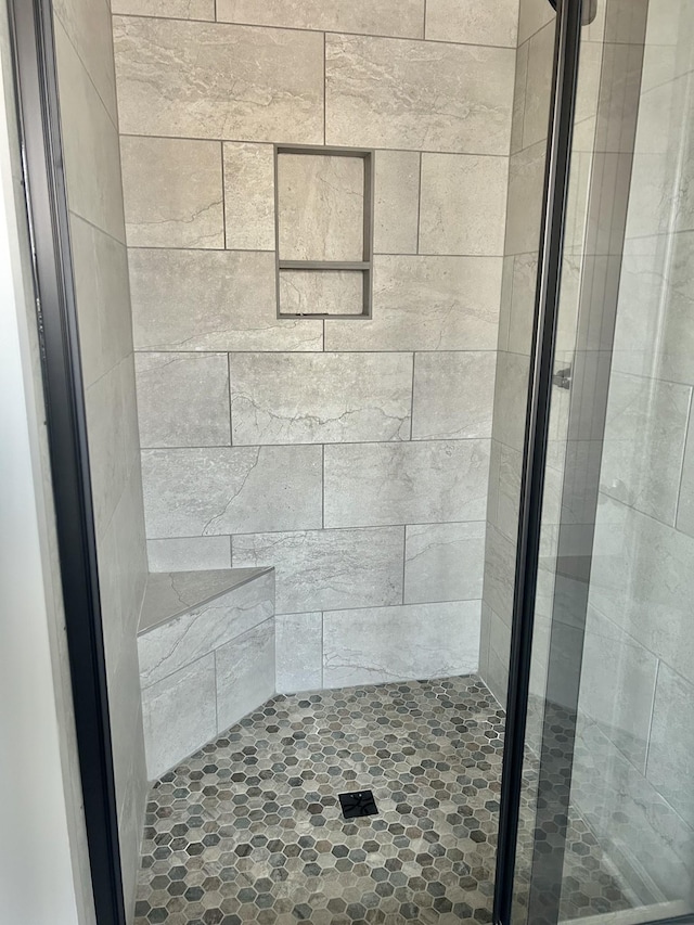 full bathroom with a stall shower