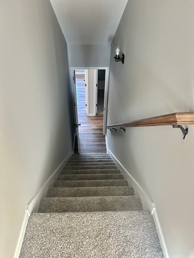 stairway featuring baseboards