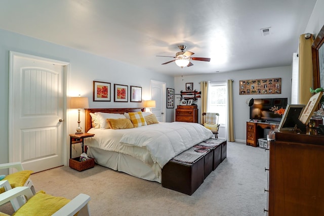 bedroom with ceiling fan and light colored carpet