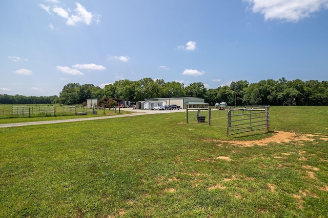 view of yard with a rural view