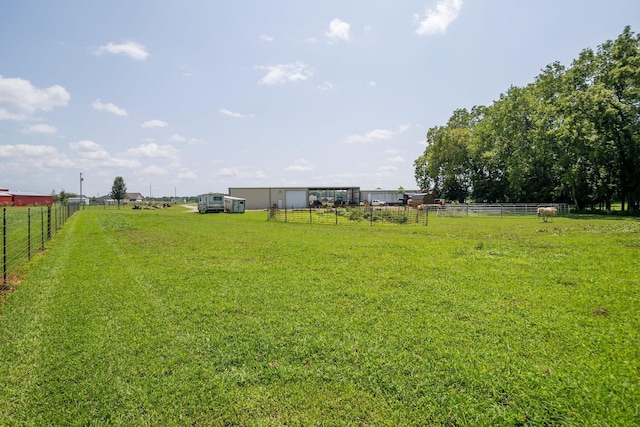 view of yard with a rural view