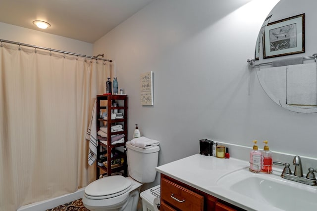 bathroom featuring vanity, a shower with shower curtain, and toilet