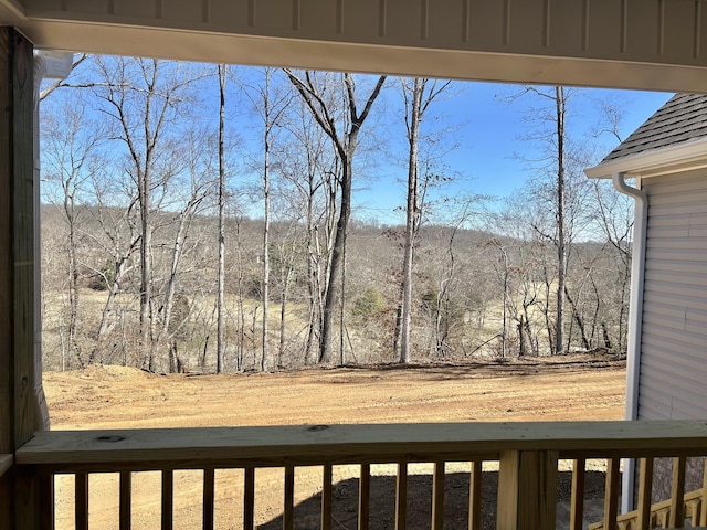 view of yard with a view of trees