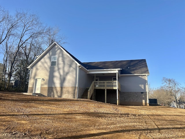 rear view of house with stairs