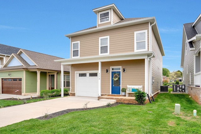 view of front of property with a garage and a front lawn