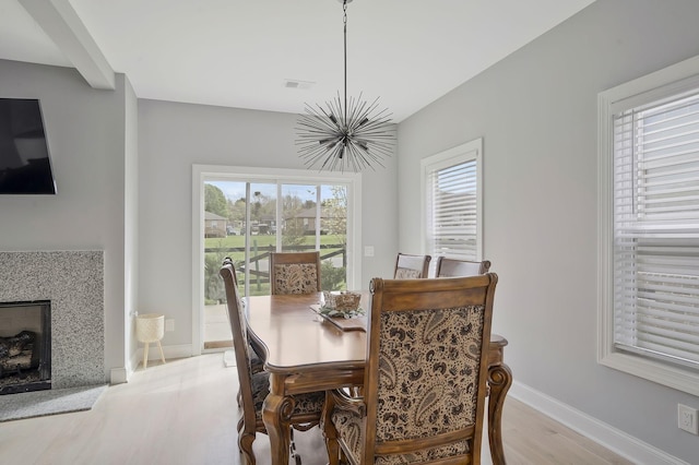 dining space with light hardwood / wood-style flooring