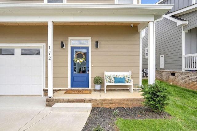 view of exterior entry featuring a garage