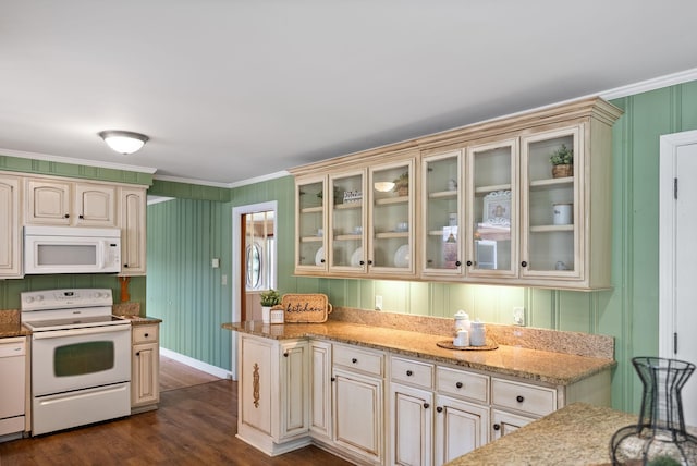 kitchen with ornamental molding, cream cabinets, and white appliances