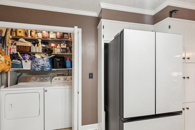 laundry area with crown molding, a textured ceiling, and independent washer and dryer