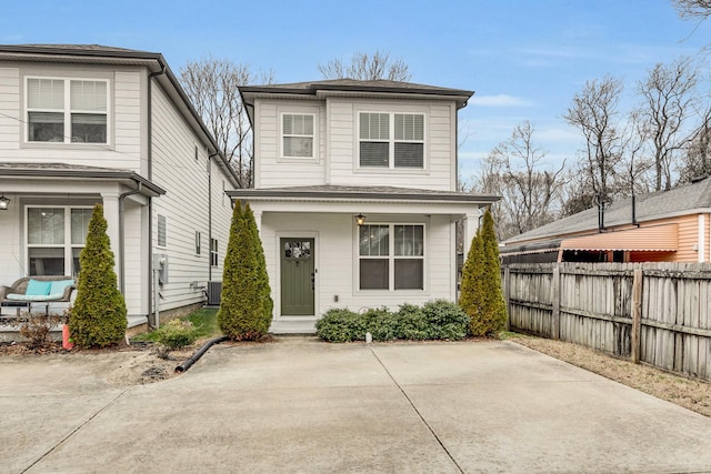 front facade with central AC unit and a patio