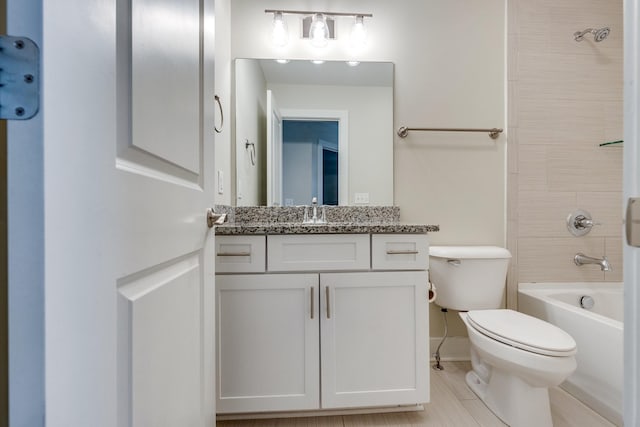 full bathroom with vanity, bathing tub / shower combination, and toilet