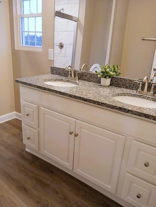 bathroom featuring vanity and wood-type flooring