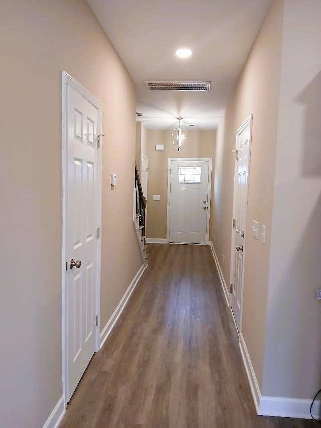 doorway with wood-type flooring