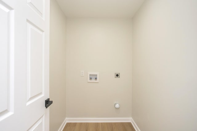 washroom featuring electric dryer hookup, washer hookup, and light wood-type flooring