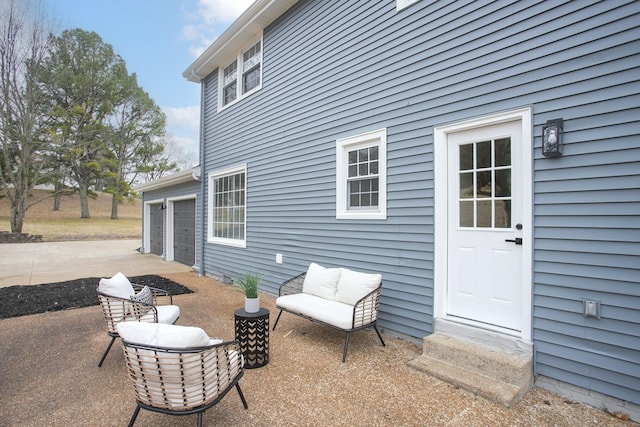 view of patio / terrace featuring a garage