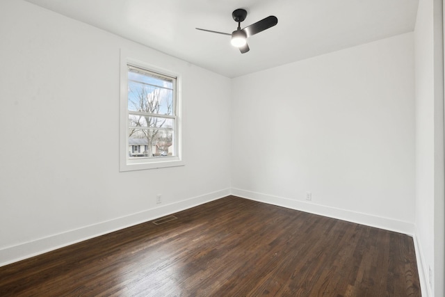 empty room featuring dark hardwood / wood-style floors and ceiling fan