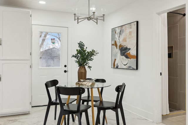 dining room with a notable chandelier