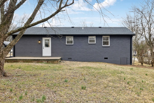 back of property featuring a lawn