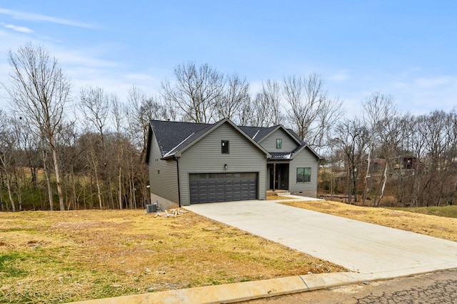 view of front property with a garage and a front lawn