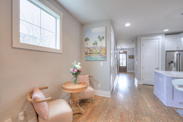 hall with light hardwood / wood-style floors