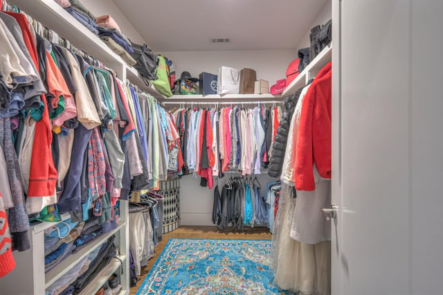 walk in closet featuring hardwood / wood-style flooring