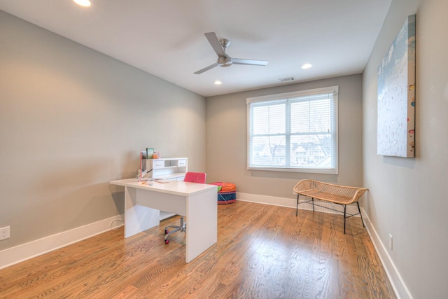 office area featuring light hardwood / wood-style floors and ceiling fan