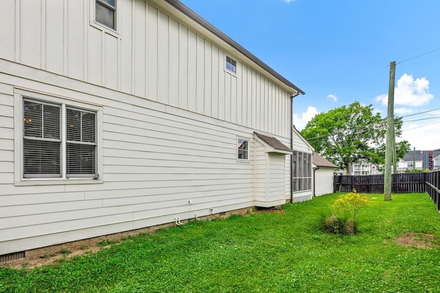 view of side of property featuring a yard