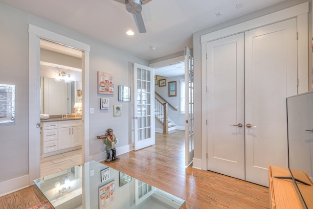 interior space with light hardwood / wood-style floors and ceiling fan