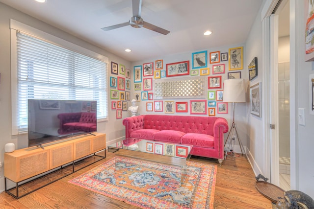 sitting room featuring ceiling fan and light hardwood / wood-style floors