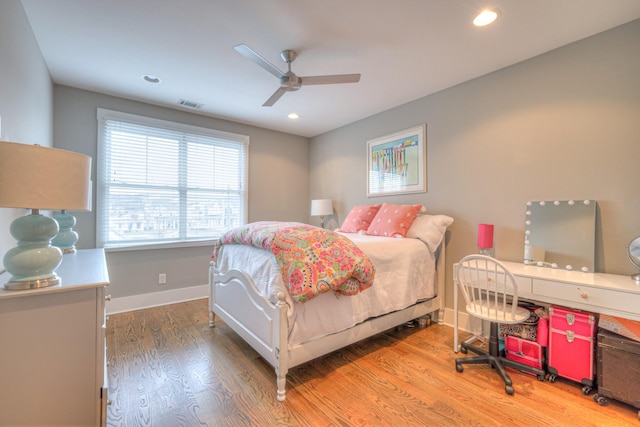 bedroom featuring hardwood / wood-style flooring and ceiling fan