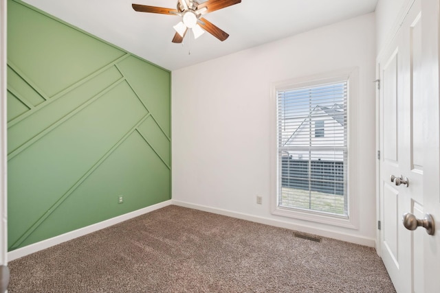 carpeted empty room with ceiling fan