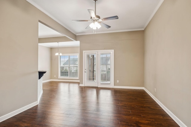 unfurnished living room featuring ornamental molding, dark hardwood / wood-style floors, and ceiling fan with notable chandelier