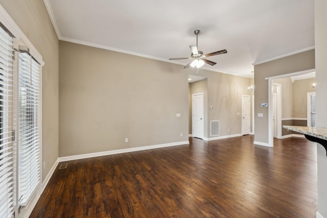 unfurnished living room featuring crown molding, ceiling fan, and dark hardwood / wood-style flooring