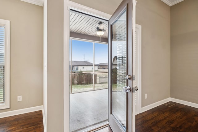 doorway featuring dark wood-type flooring and ceiling fan