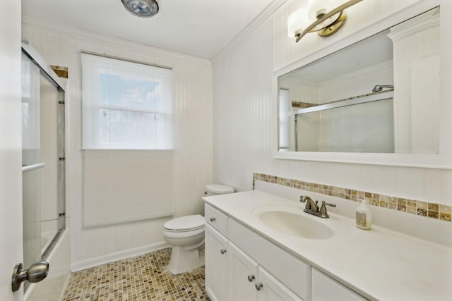 full bathroom with enclosed tub / shower combo, crown molding, vanity, and toilet