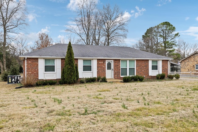 ranch-style home with a front yard