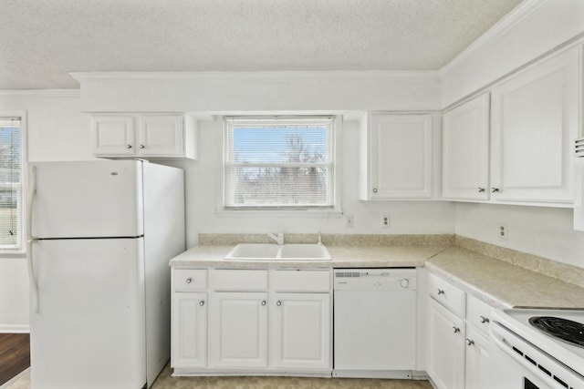 kitchen featuring white cabinetry, sink, a textured ceiling, and white appliances