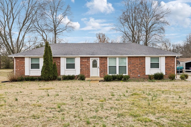 single story home featuring a front lawn