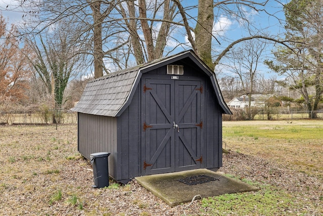 view of outdoor structure with a lawn