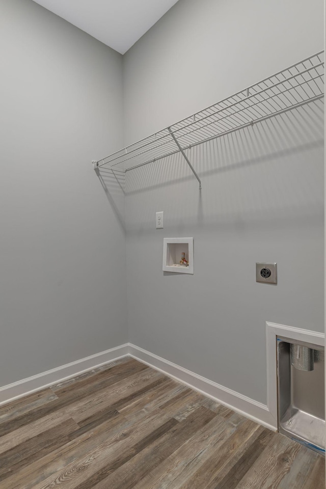 clothes washing area with washer hookup, hookup for an electric dryer, and hardwood / wood-style floors