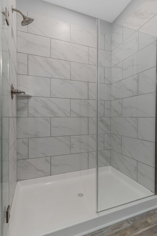 bathroom with a shower with shower door