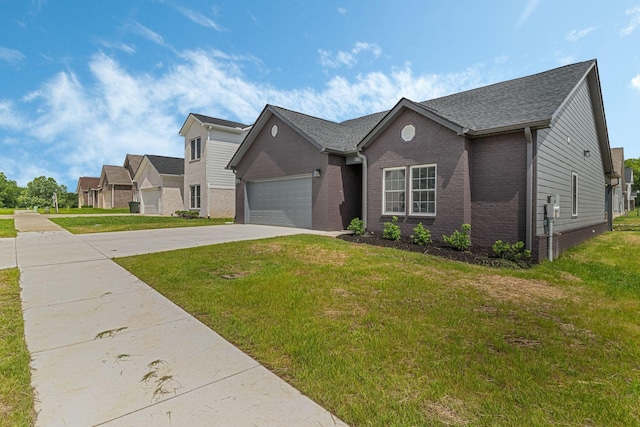 view of front facade featuring a garage and a front lawn