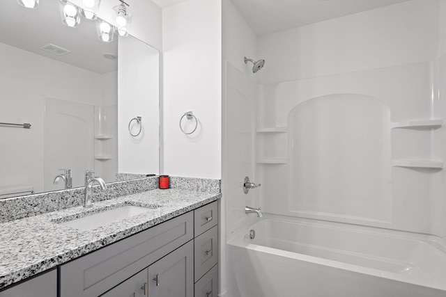 bathroom featuring vanity and shower / bathtub combination