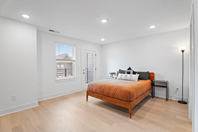 bedroom with light hardwood / wood-style floors