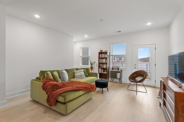 living room with light hardwood / wood-style floors