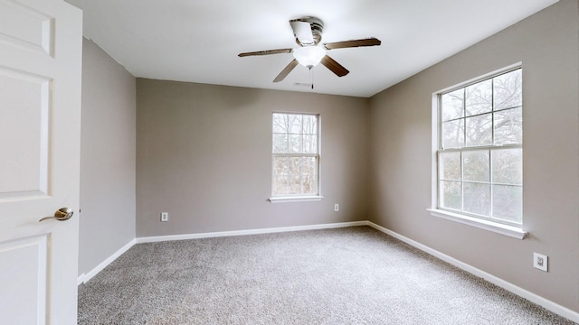 empty room with carpet floors and ceiling fan