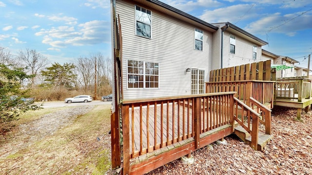 rear view of property featuring a deck