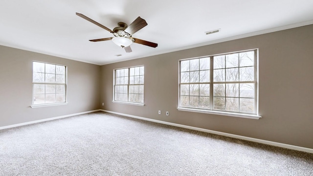 unfurnished room with ceiling fan, ornamental molding, and carpet floors